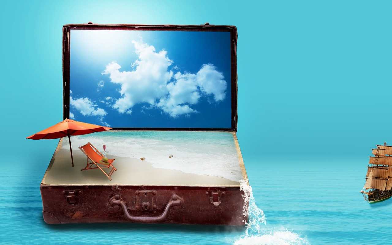 Una spiaggia esce da una valigia
